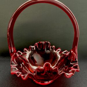 Amberina Fenton basket with a black background