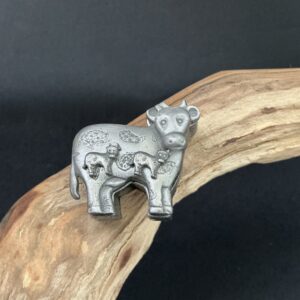 Pewter cow trinket box with pierced post earring calves the cover brooch perched on driftwood